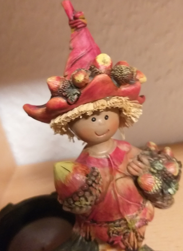 Autumn decoration dwarf with forest fruits and tea light basket
